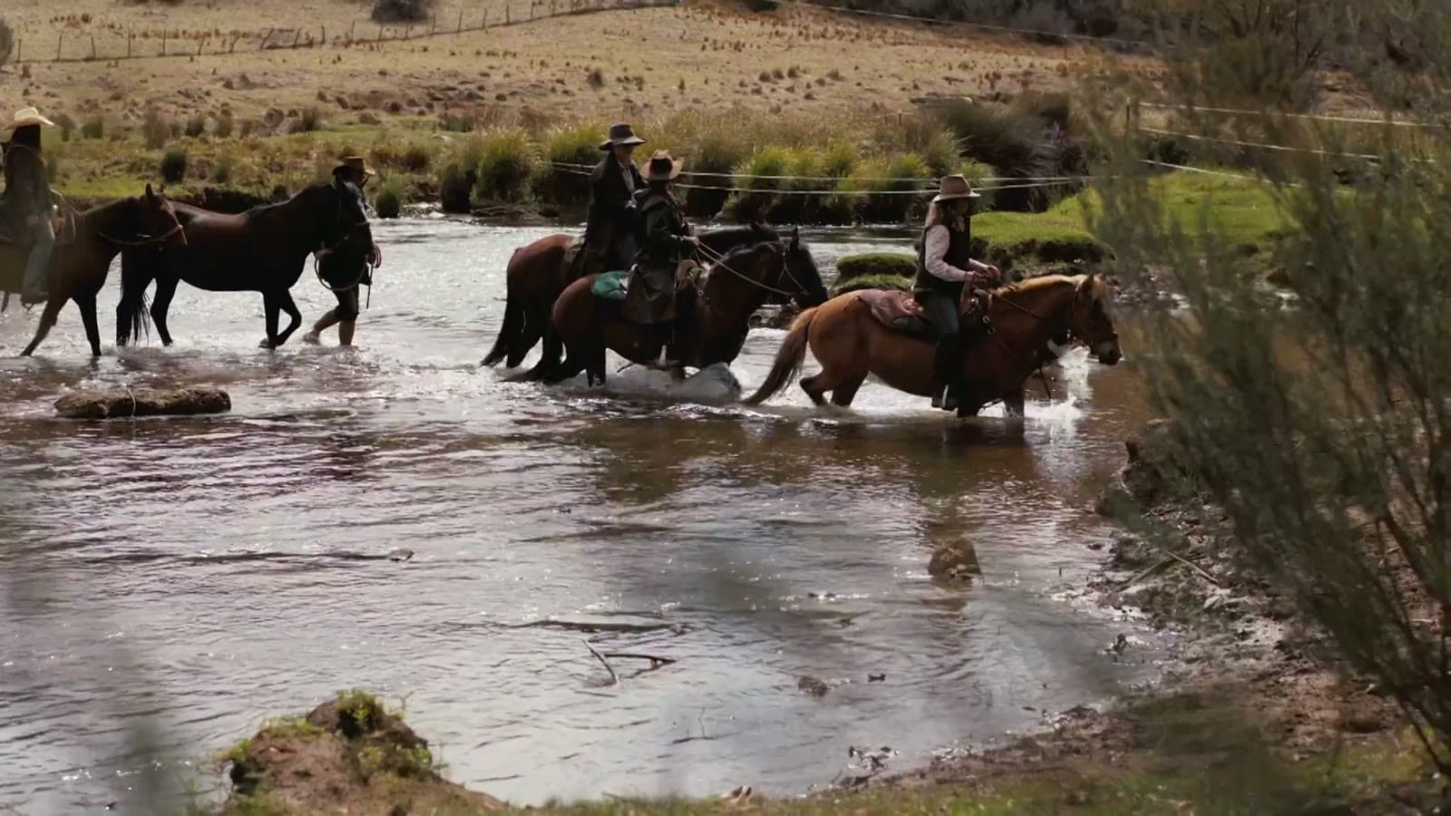 Riders crossing a river during the Driza-Bone shoot